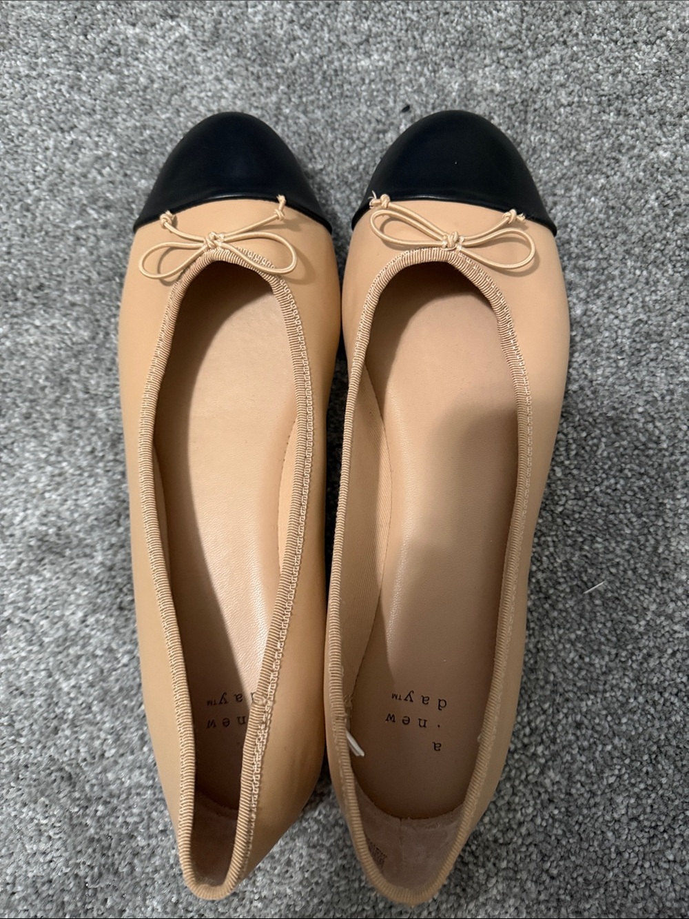a new day Beige Ballet Flats with Black Cap Toe and Bow